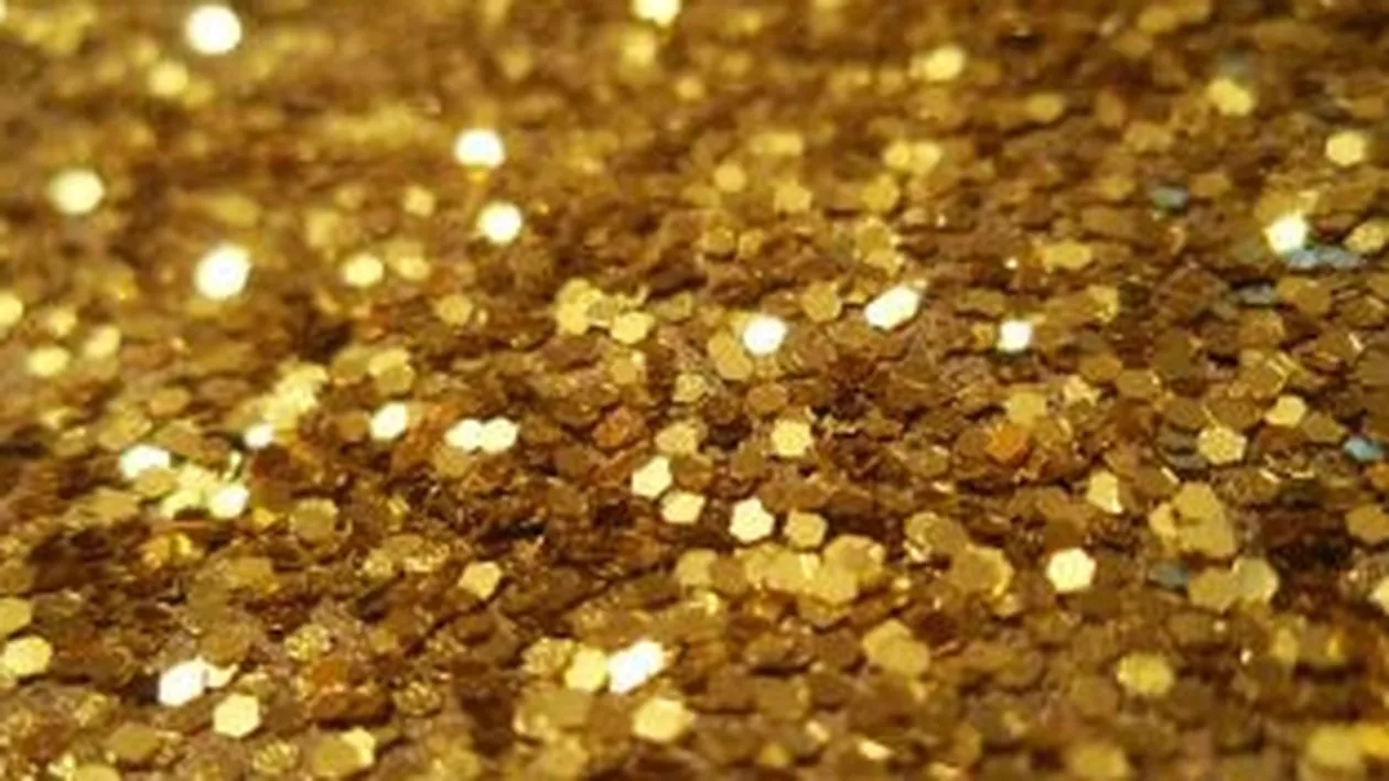 Cea mai puternică “monedă” din ultimii 12 ani: Aurul ar putea trece de 2.000 dolari pe uncie în 2013