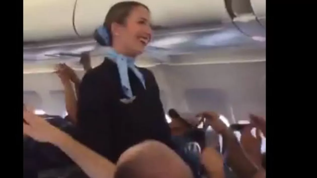 O STEWARDESĂ nu îi poate CONTROLA pe FANII care merg spre FINALA Champions League! Ce CÂNTĂ suporterii (VIDEO)