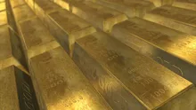 Preţul aurului urcă la nivel record, în contextul incertitudinilor privind evoluția dolarului