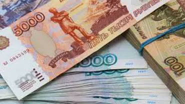 Acţiunile ruseşti şi rubla cresc după ce Putin a spus că a retras trupele de la graniţa cu Ucraina