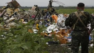 Primele cadavre ale victimelor malaeziene din zborul MH17 au fost repatriate