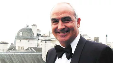 Nicolae Raţiu, distins de regina Elizabeth a II-a cu titlu de Membru al Ordinului Britanic