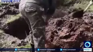 IMAGINI ŞOCANTE: Soldați ucrainieni îngroapă de viu un separatist rus (VIDEO)