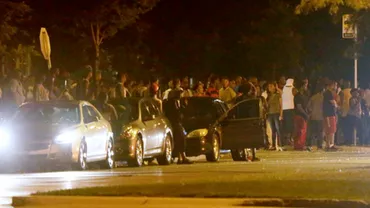 Proteste violente în SUA după ce un tânăr a fost împuşcat mortal de un poliţist (VIDEO)