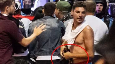 ALERTĂ! Huliganul căutat de Poliţie, surprins cu ARMA jandarmeriţei bătute la mitingul din Piaţa Victoriei! (FOTO)