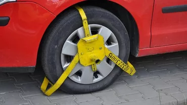 Blocarea roților în parcările supermarketurilor, ILEGALĂ. Ce trebuie să facă șoferii când își găsesc mașina așa...