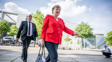 De ce nu a fost văzută Angela Merkel purtând mască până acum. Cum a răspuns cancelarul Germaniei